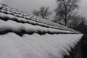 How Snow & Ice Impact Flat Commercial Roofs